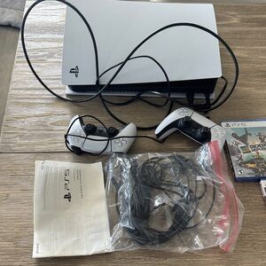 PlayStation 5 brand new with 5 games 2 controllers accessories